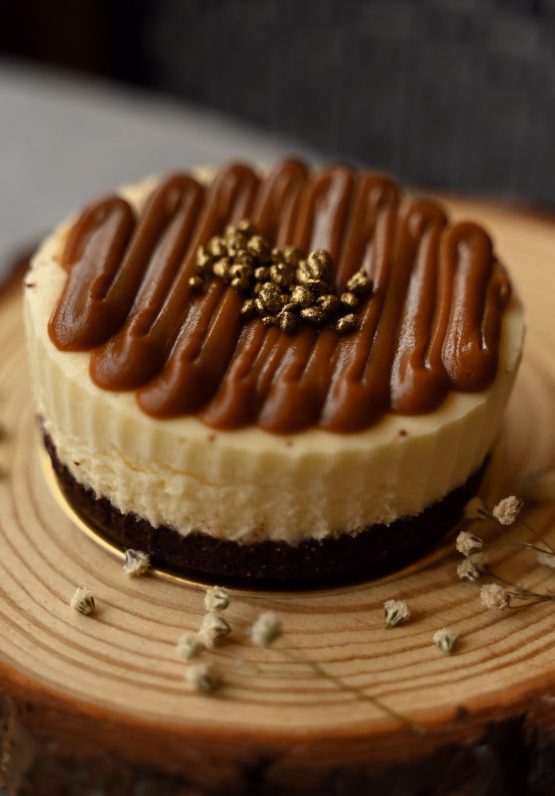 A dulce de leche cheesecake finished with gold leaf